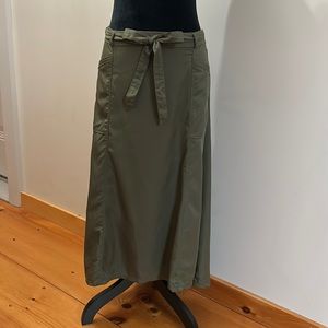 Army green maxi skirt with pockets, tie belt, and elastic back